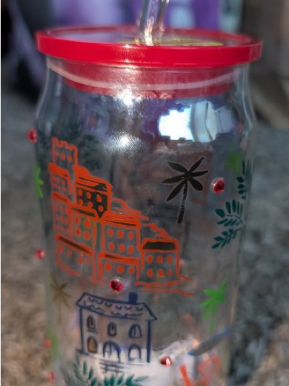 Othr Clear Travel Tumbler with Red Lid and Multicolor Village Design
